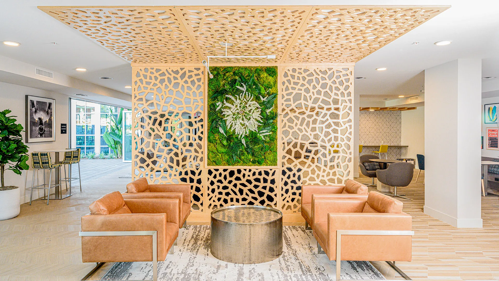 Organic coral-form perforated cladding with moss insert as room divider