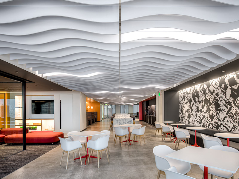 MUTO wavy cloud baffles suspended above open office