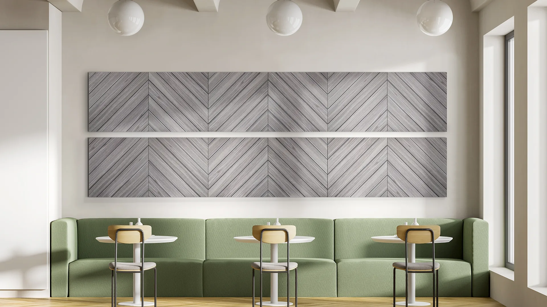 Gray chevron herringbone sound dampening panels above green banquette seating