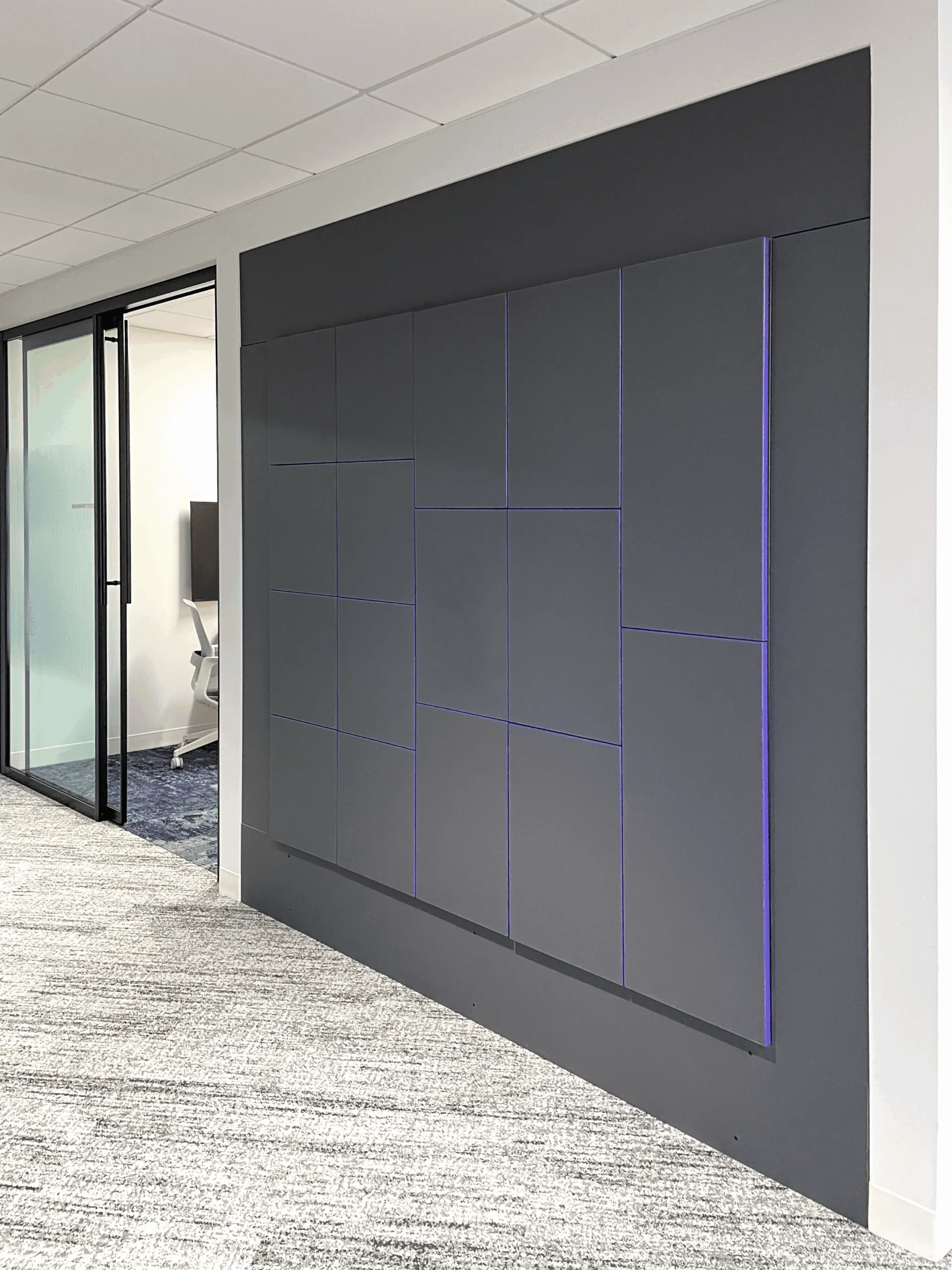Chubb Dallas dark charcoal locker wall with a fine purple Abet Laminati seam grid