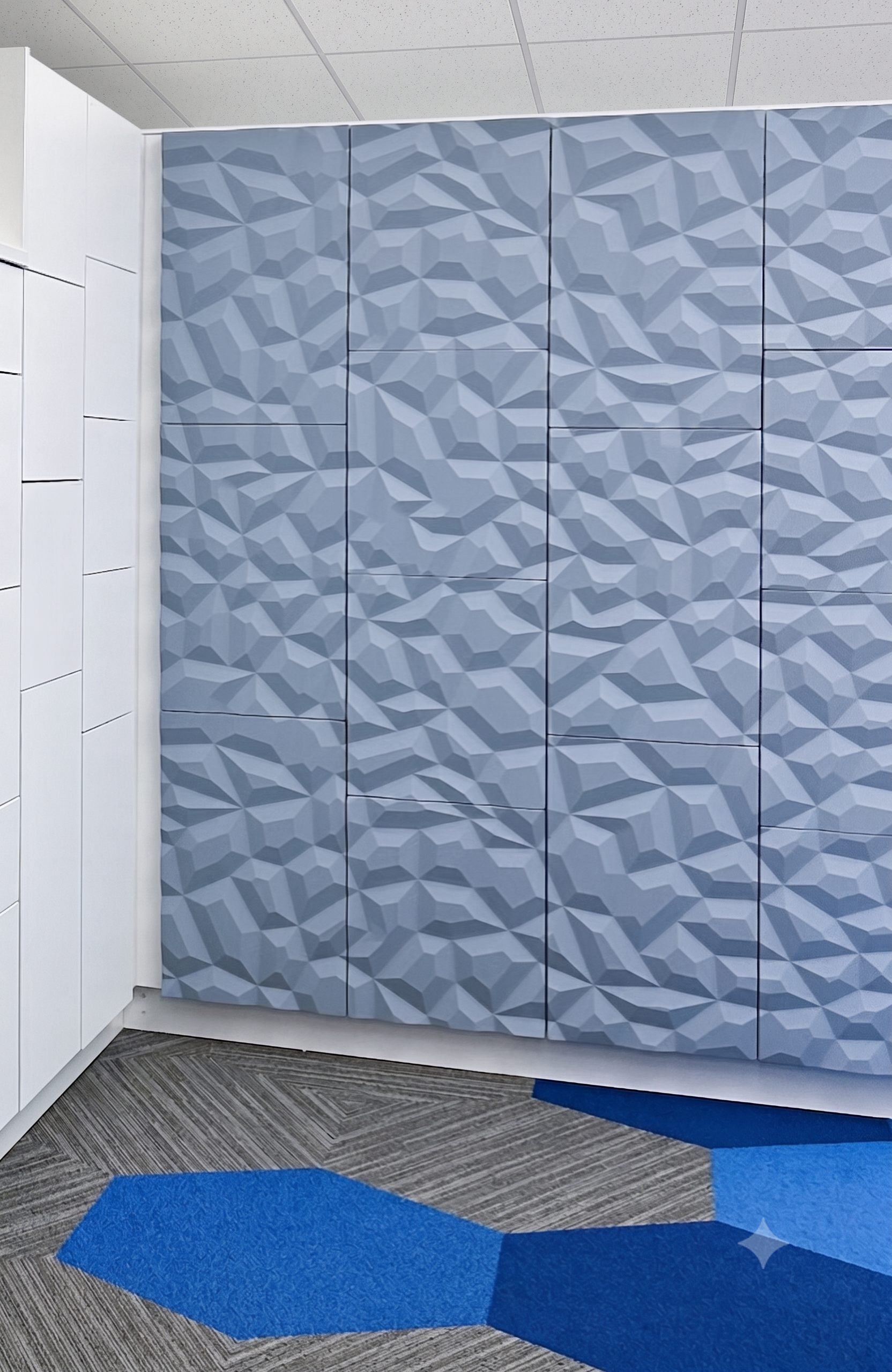 Geometric faceted vinyl wrap locker wall in showroom