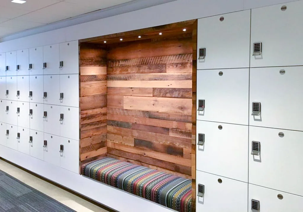 Locker bank with integrated wood seating niche, Barclays