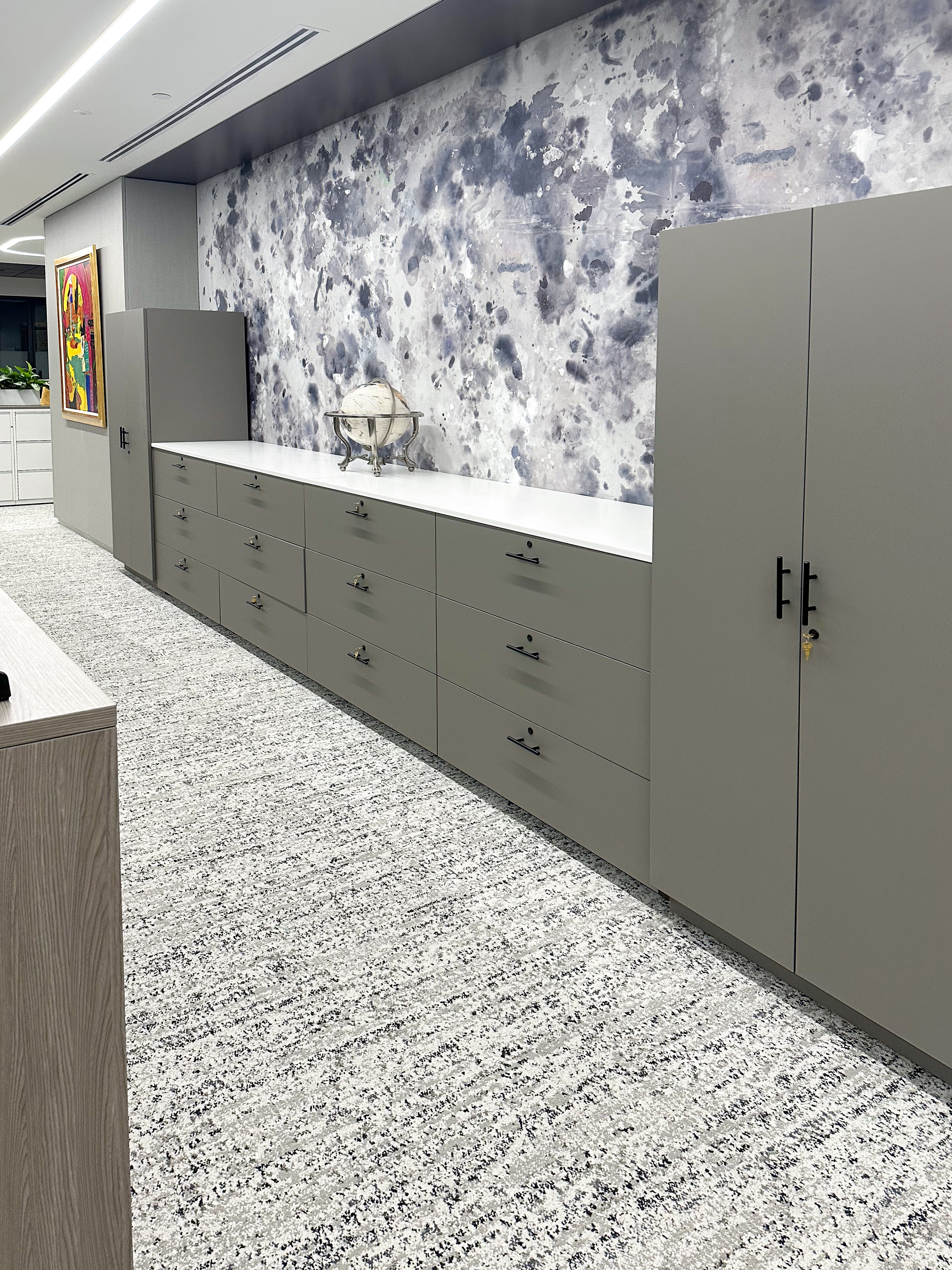 Casework storage wall with drawers and open shelving