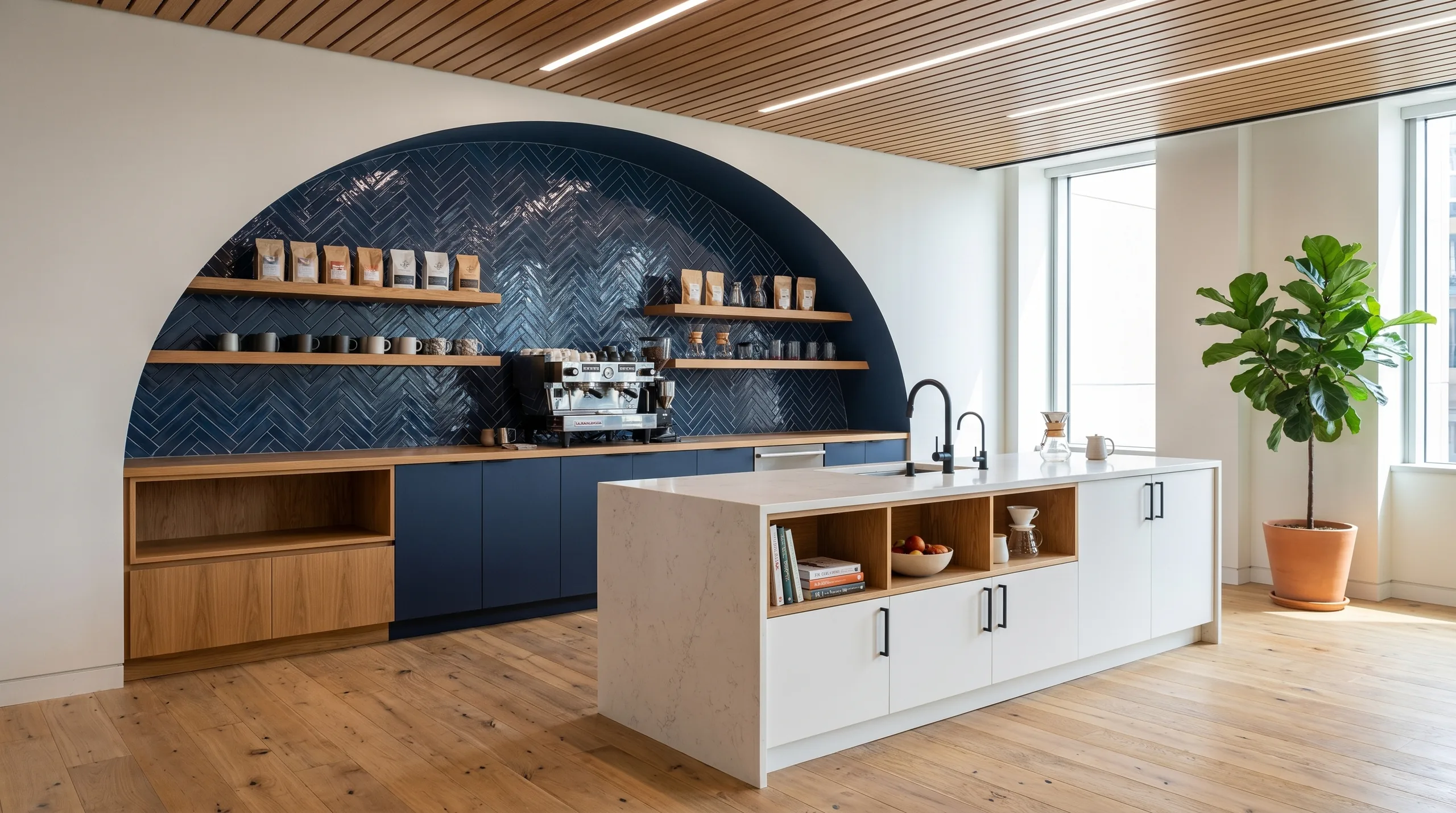 Tech office kitchenette with navy arched niche and herringbone tile