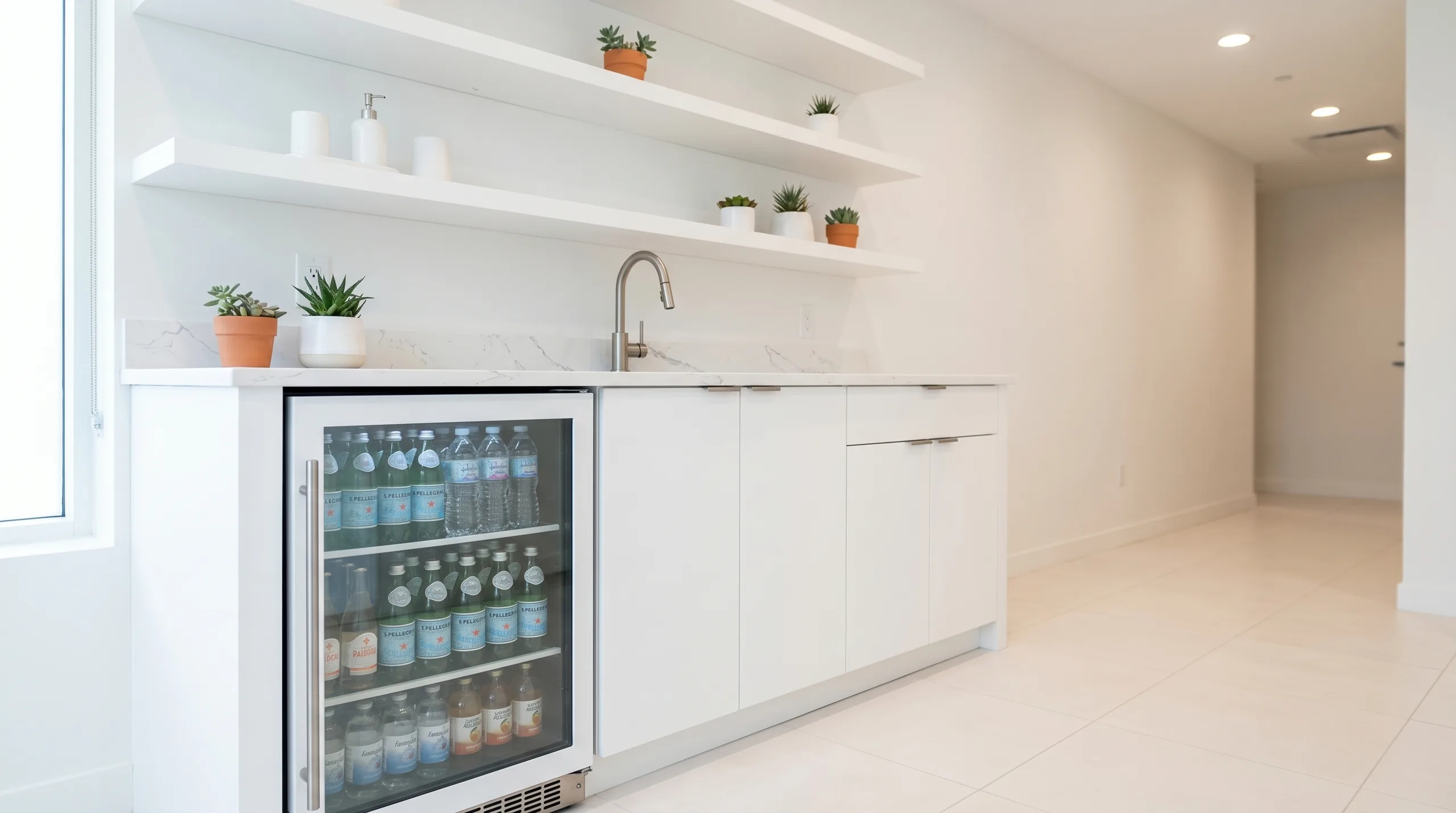 Wellness center hydration station with white casework and glass-door fridge