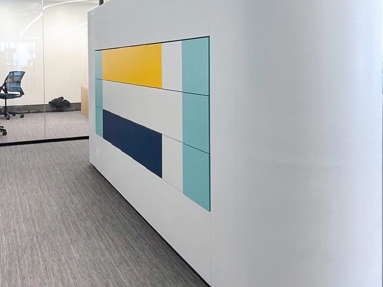 Curved white divider with an inset color-block panel in yellow, navy, and teal