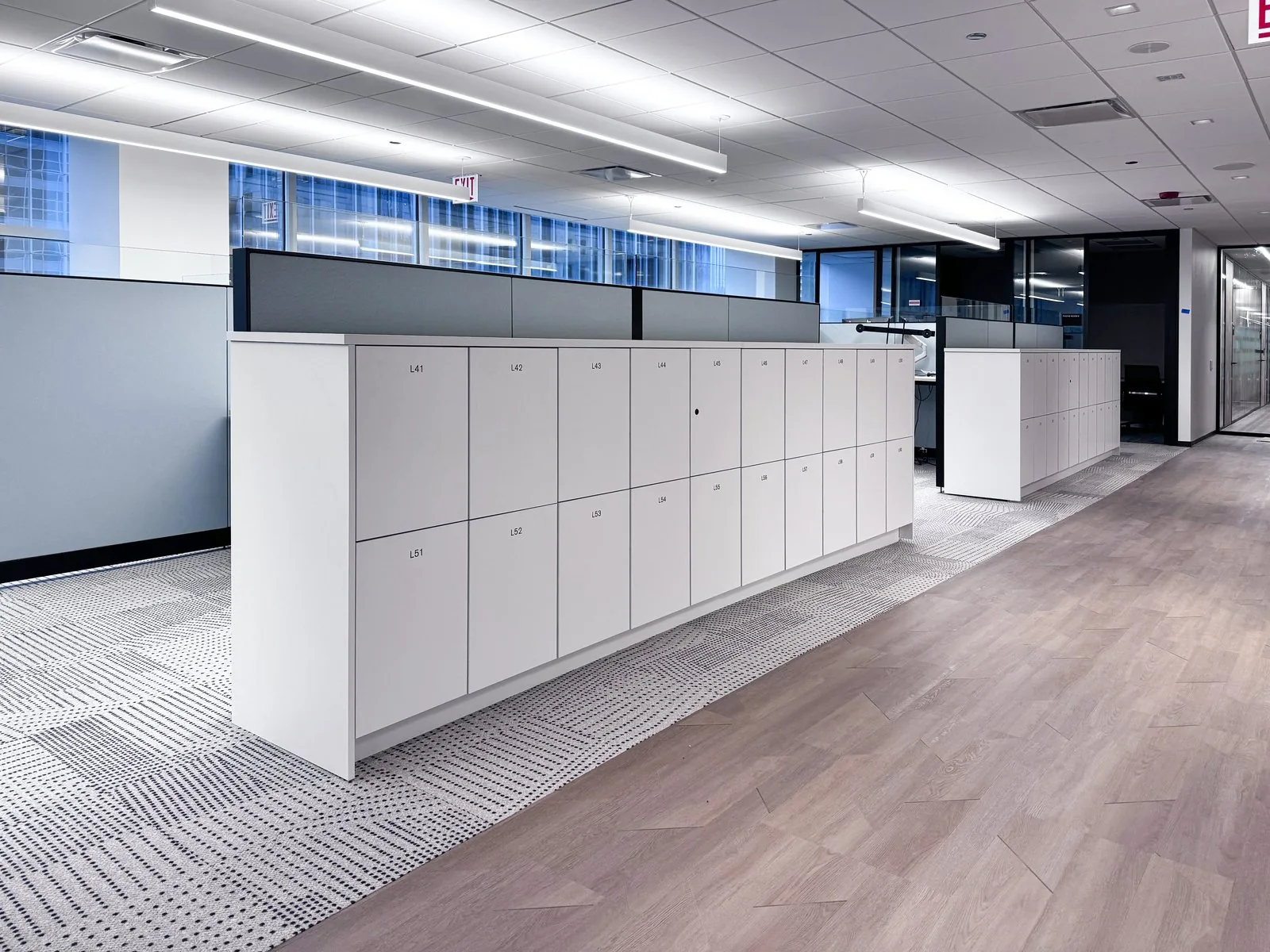 White locker units used as low dividers between workstation neighborhoods