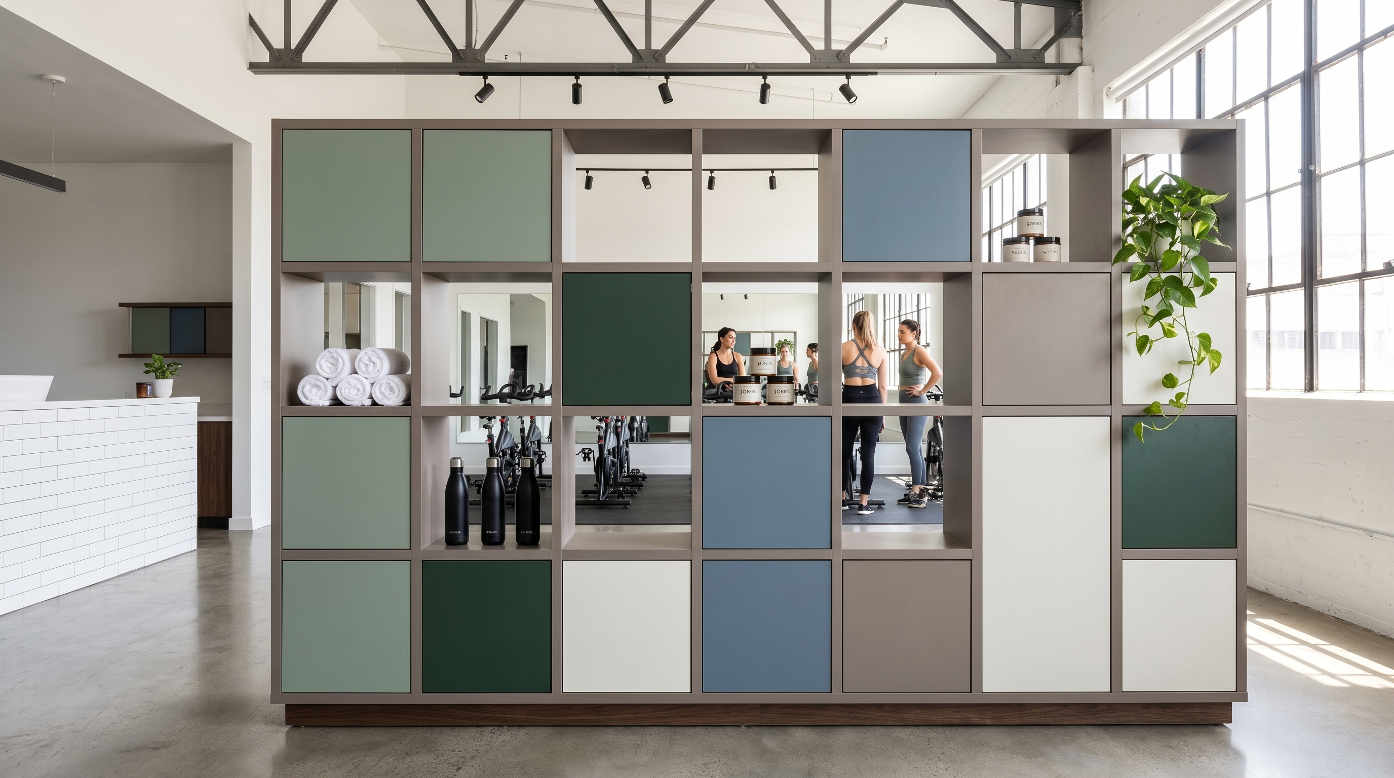 Zone Divider on boutique fitness training floor with open cubbies, closed storage, and studio sightlines behind